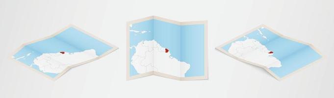 gevouwen kaart van Frans Guyana in drie verschillend versies. vector