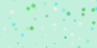 lichtblauw, groen vector doodle textuur met bloemen.