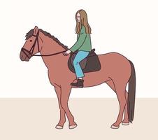 een meisje rijdt paard.