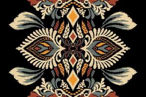 ikat bloemen paisley borduurwerk Aan zwart achtergrond.ikat etnisch oosters patroon traditioneel.azteken stijl abstract vector illustratie.ontwerp voor textuur,stof,kleding,verpakking,decoratie,sjaal,tapijt