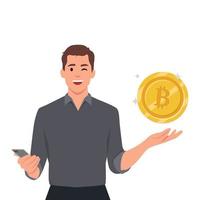 jong bitcoin miljonair. Mens Holding bitcoin en houdt de telefoon in hand- vector