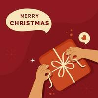 vrolijk Kerstmis poster ontwerp met top visie van hand- Holding lint van geschenk doos Aan rood achtergrond. vector