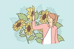 vrouw staat in veld- met zonnebloemen genieten van natuur en biologisch planten gegroeid zonder gebruik van pesticiden. zonnebloemen bloemen in de buurt meisje wie bezit agrarisch plantage of agro boerderij vector