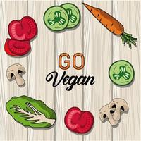 ga vegan belettering poster met groenten rond op houten achtergrond vector