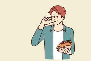 Mens met hamburger likt vingers en geniet ontvangst van snel voedsel kocht in straat restaurant of besteld voor levering. glimlachen vent Holding smakelijk kaas hamburger terwijl aan het eten belegd broodje met kotelet vector