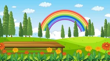 natuurpark scène achtergrond met regenboog in de lucht vector
