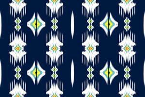 naadloos patroon van ikat paisley, traditioneel naadloos patroon, donker blauw achtergrond, aztec stijl, borduurwerk, abstract, vector, ontwerp illustratie voor textuur, kleding stof, afdrukken. vector