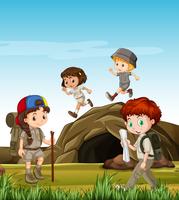 Kinderen kamperen bij de grot vector