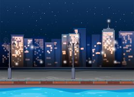 Scène met gebouwen in de nacht vector