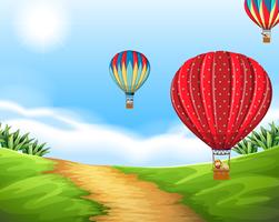 Hete luchtballon in aardlandschap vector