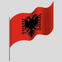 zwaaide Albanië vlag. Albanië vlag Aan vlaggenmast. vector embleem van Albanië