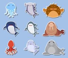 Sticker met zeedieren op blauwe achtergrond wordt geplaatst die vector
