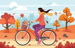 mooie vrouw die fiets berijdt in de herfstpark vector
