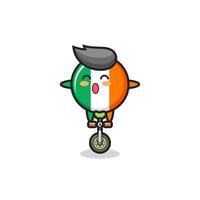 het schattige personage met de vlag van Ierland rijdt op een circusfiets vector