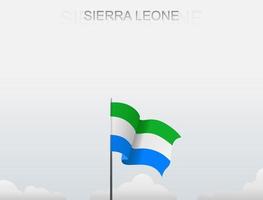 vlag van sierra leone die onder de witte lucht vliegt vector