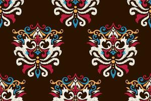 ikat bloemen paisley borduurwerk Aan bruin achtergrond.ikat etnisch oosters naadloos patroon traditioneel.azteken stijl abstract vector illustratie.ontwerp voor textuur, stof, kleding, verpakking, decoratie.