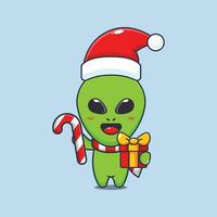 schattig buitenaards wezen Holding Kerstmis snoep en geschenk. schattig Kerstmis tekenfilm karakter illustratie. vector