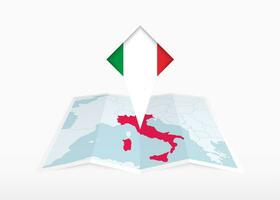 Italië is afgebeeld Aan een gevouwen papier kaart en vastgemaakt plaats markeerstift met vlag van Italië. vector