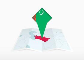 turkmenistan is afgebeeld Aan een gevouwen papier kaart en vastgemaakt plaats markeerstift met vlag van Turkmenistan. vector
