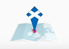 Schotland is afgebeeld Aan een gevouwen papier kaart en vastgemaakt plaats markeerstift met vlag van Schotland. vector