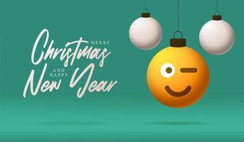 vrolijke kerstkaart met glimlach emoji gezicht. vectorillustratie in vlakke stijl met xmas belettering en emotie in kerstbal hangen aan draad op achtergrond vector