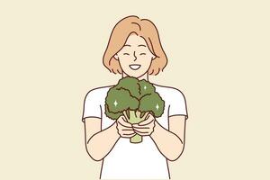 gelukkig vrouw met broccoli in handen beveelt aan gaan veganistisch en aan het eten enkel en alleen vers biologisch groenten. glimlachen meisje Holding broccoli gevulde met nuttig vitamines voor lichaam en immuniteit. vector