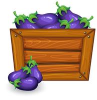 Aubergine op een houten bord vector