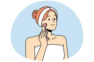 glimlachen jong vrouw in handdoek maken gezicht massage met schoonheid rol. gelukkig meisje Doen gelaats behandeling in badkamer. huidsverzorging concept. vector illustratie.