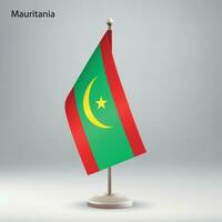 vlag van mauritania hangende Aan een vlag stellage. vector