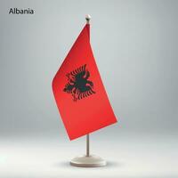 vlag van Albanië hangende Aan een vlag stellage. vector