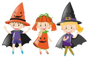 Drie kinderen in halloween-kostuum vector