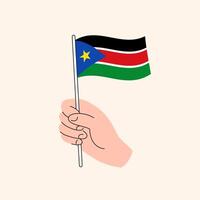 tekenfilm hand- Holding zuiden sudanees vlag, geïsoleerd vector ontwerp.