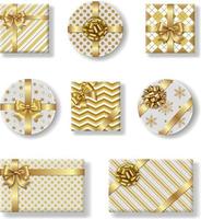 set van geïsoleerde kerstcadeaudozen met gouden strik vector