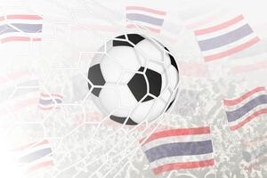 nationaal Amerikaans voetbal team van Thailand scoorde doel. bal in doel netto, terwijl Amerikaans voetbal supporters zijn golvend de Thailand vlag in de achtergrond. vector