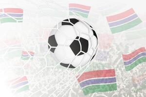 nationaal Amerikaans voetbal team van Gambia scoorde doel. bal in doel netto, terwijl Amerikaans voetbal supporters zijn golvend de Gambia vlag in de achtergrond. vector