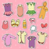 vector set baby kleding stickers. stijlvolle baby outfit set geïsoleerd op roze polka-dot achtergrond