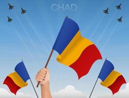 Tsjaad vlaggen vliegen onder de blauwe lucht vector