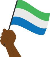 hand- Holding en verhogen de nationaal vlag van Sierra Leone vector