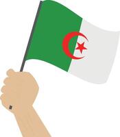 hand- Holding en verhogen de nationaal vlag van Algerije vector