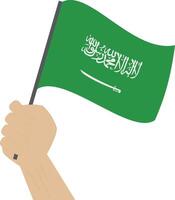 hand- Holding en verhogen de nationaal vlag van saudi Arabië vector