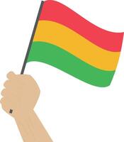 hand- Holding en verhogen de nationaal vlag van Bolivia vector