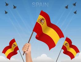 Spaanse vlaggen die onder de blauwe lucht vliegen vector