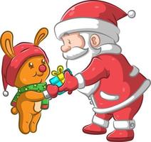 de grote kerstman die het kleine geschenk aan het gele konijn geeft vector