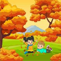 cartoon gelukkige kinderen spelen in de herfst achtergrond vector