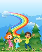 Een gelukkig gezin in de buurt van de dennenbomen met een regenboog aan de hemel vector