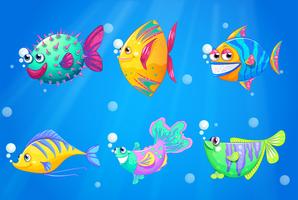 Een oceaan met een groep kleurrijke vissen vector