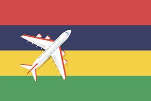 vectorillustratie van een passagiersvliegtuig dat over de vlag van mauritius vliegt. concept van toerisme en reizen vector