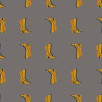 hand getekende gele laarzen naadloze patroon in fashion stijl. grijze achtergrond. cartoon stijl sieraad. vector
