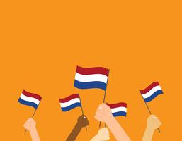 Vectorillustratieknoppen die de vlaggen van Nederland op oranje achtergrond houden