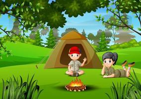 twee kinderen kamperen in het bos vector